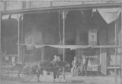 1895  Ernest Jesse Palmer standing behind his father's team of horses ready to deliver groceries in Webb City, Missouri